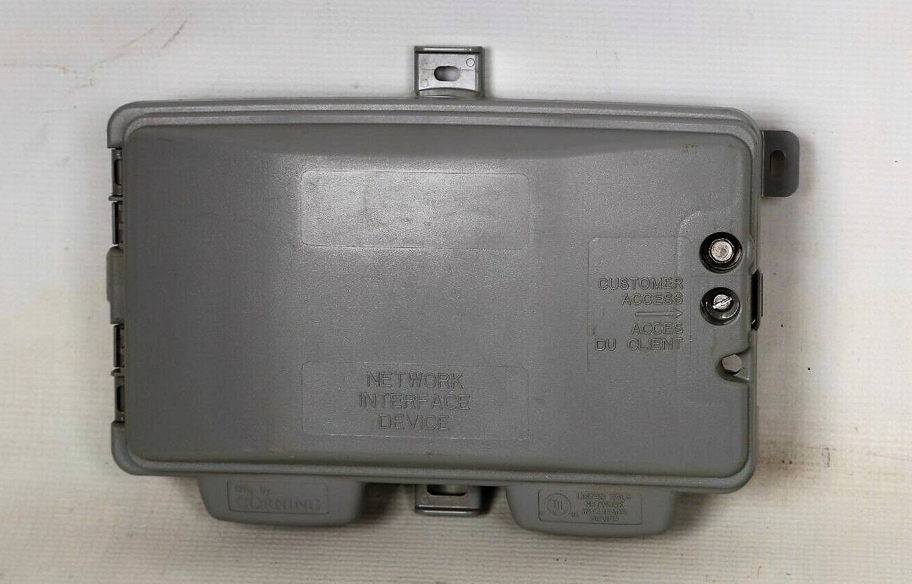 Photo of network interface device, or NID, attached to exterior of house