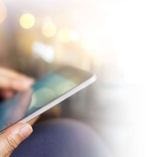 woman in bed with phone