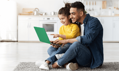 adult and child looking at laptop